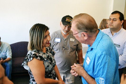 State Senator Melissa Hurtado speaks with a constituent at an open house for her Hanford office, located at 611 N. Douty Street in Hanford.